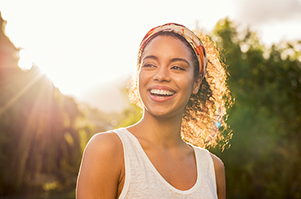 Image of a smiling woman at The Center for Esthetic Dentistry.