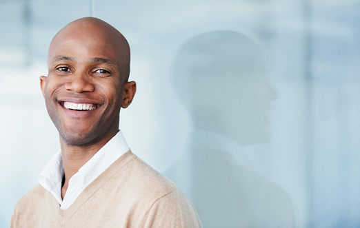 Image of a man smiling after getting a dental veneer, at The Center for Esthetic Dentistry in Grants Pass, OR.